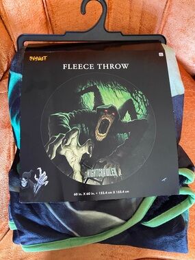 Spirit Halloween black & green Nightcrawler fleece throw blanket
